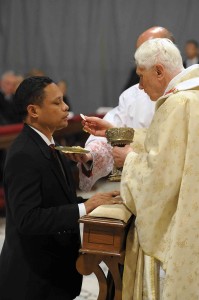 Armindo Pedro Simoes receives Communion from Pope Benedict