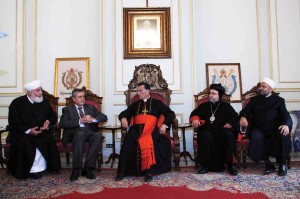 Patriarch Bechara Rai welcomes a Syrian religious delegation, and Syrian Ambassador to Lebanon Ali Abdul Karim Ali, second from left, in Bkerke, Lebanon, on September 28 (CNS photo).