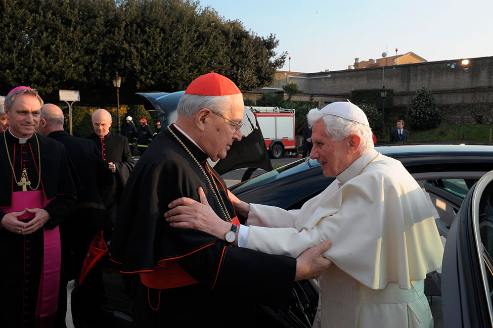 Pope Benedict XVI embraces Cardinal Angelo Sodano, Dean of the College of Cardinals, as he leaves the Vatican for Castel Gandolfo, Italy, February 28. “I am a simple pilgrim who begins the last stage of his pilgrimage on this earth,” the Pope said at the close of his papacy. (CNS photo / L'Osservatore Romano via Reuters)