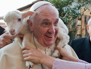 Pope Francis, like the "Good Shepher" in Scripture, carries a lamb on his shoulders. He was visiting the Roman parish of St Alphonsus Maria de Lihuori on January 6, the Feast of the Epiphany, to see an enormous living manger scene 200 parishioners were participating in. The Pope spoke personally with each one of the 200, embracing and blessing them.