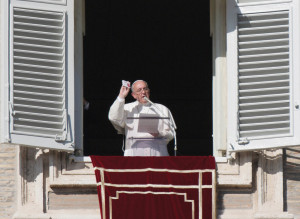 Pope Francis at the end of the Angelus, with a box of Misericordina in his hand. 