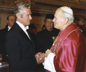 St. Peter's Square at the Vatican January 8. The Pope spotted the priest in the crowd and invited him to board the popemobile.  Here, top, William A. Wilson, the first U.S. ambassador to the Vatican, is greeted by Pope John Paul II at the Vatican in this 1985 file photo. Wilson died on December 5 at his home in Carmel, Calif. He was 95. President Ronald Reagan named Wilson ambassador in 1984 after establishing full diplomatic relations with the Vatican.