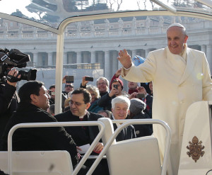 A visitor on the Popemobile. 