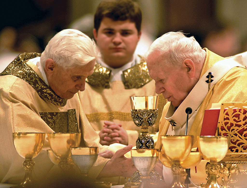 The views of the young Father Joseph Ratzinger on the liturgy were developed over the years, and in his papacy. Here, a concelbration of Mass by St. John Paul II and then-Cardinal Ratzinger (CNS photo). 