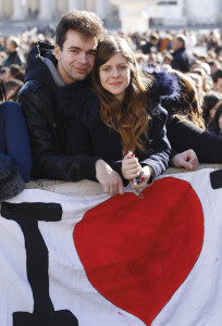 A young couple at St. Peter's Square. 