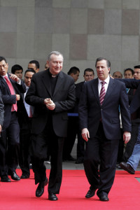 Mexican Foreign Minister Jose Antonio Meade Kuribrena walks with Cardinal Pietro Parolin, Vatican Secretary of State, in Mexico City on July 13.  Cardinal Parolin traveled to Mexico to discuss the flow of child migrants from Central America with regional counterparts (CNS photo/courtesy of SRE). 