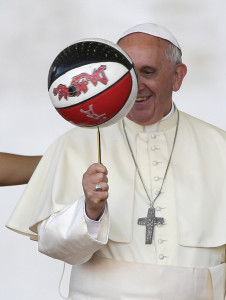 Pope Francis balances a basketball during a special audience for members of CSI (Italian sport centers) in St. Peter’s Square at the Vatican June 7.