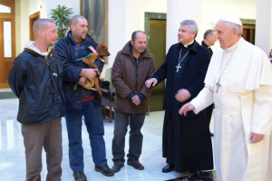 On December 17, 2013, Pope Francis and Archbishop Krajewski met with three homeless men who live near the Vatican.