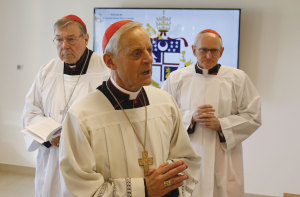 Cardinal Pell, Wuerl and Harvey attend the dedication of the new building. 