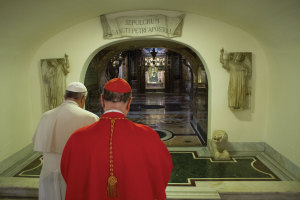 Pope Francis and Cardinal Angelo Comastri, archpriest of St. Peter’s Basilica, pray in front of the tomb of St. Peter the Apostle in the crypt of the Basilica on November 2, the Feast of All Souls.