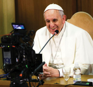 Pope Francis looks into a camera during a worldwide broadcast online as he leads a meeting for the Fourth World Congress of Educational Scholas Occurrentes February 5.