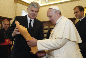 Dragan Covic, Croat member of the presidency of Bosnia-Herzegovina, presents a statue as a gift to Pope Francis in the Apostolic Palace at the Vatican December 15.