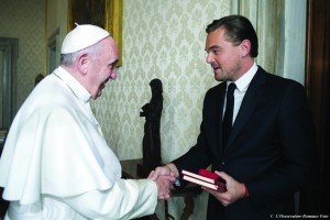 Pope Francis meets actor Leonardo DiCaprio in the Apostolic Palace at the Vatican Jan. 28. DiCaprio is holding gifts received from the pope. (CNS photo/L'Osservatore Romano, handout)