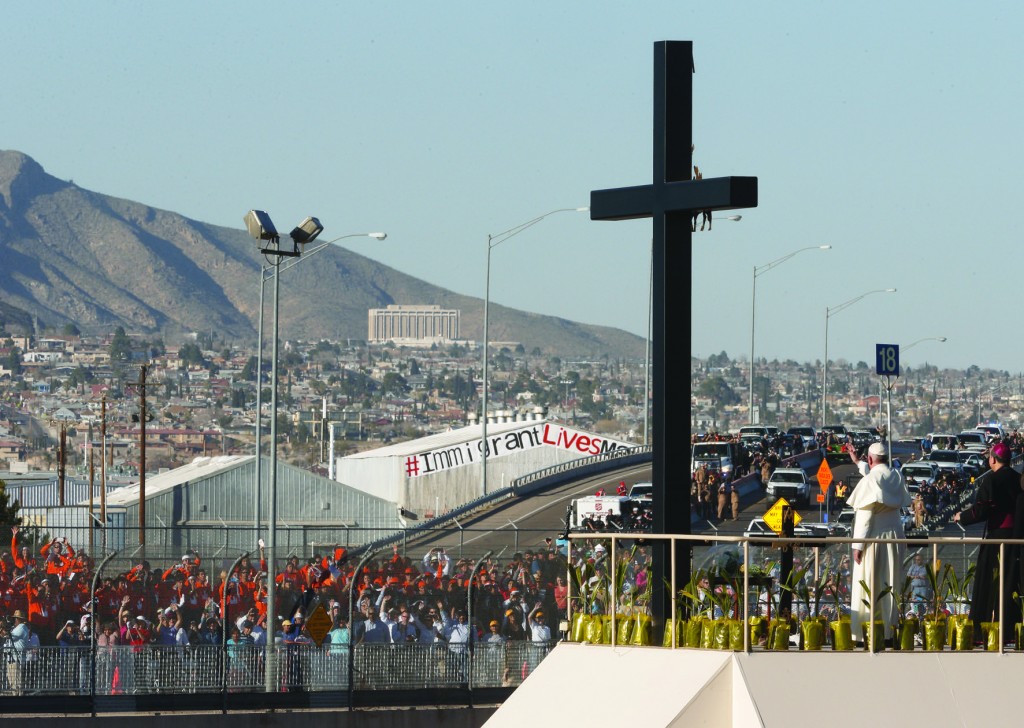 Pope Francis waves to people gathered in El Paso, Texas, after praying at a cross on the Mexican side of the border in Ciudad Juarez, Mexico, Feb. 17. (CNS photo/Paul Haring) See POPE-JUAREZ-MASS Feb. 17, 2016.
