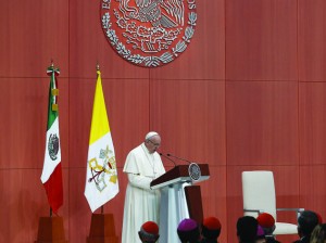 Pope Francis addresses representatives of civil society and the diplomatic corps during a meeting attended by Mexican President Enrique Pena Nieto, right, at the National Palace in Mexico City Feb. 13. (CNS photo/Paul Haring) See POPE-MEXICO-WELCOME Feb. 13, 2016.
