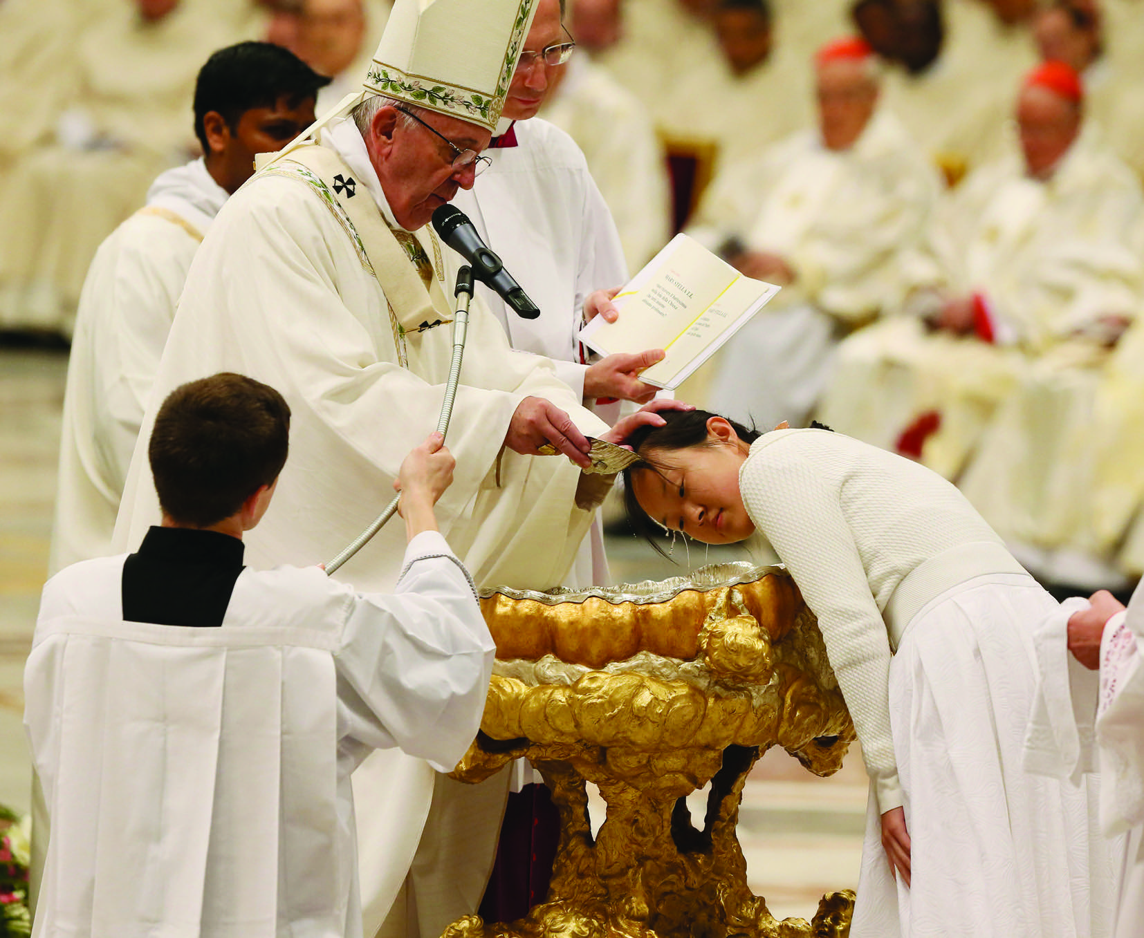 26/03/2016 Vatican Basilica. Holy Saturday. Easter Vigil in the Holy Night and Holy Mass celebrated by Pope Francis. The Holy Father imparts the sacrament of baptism to the neophytes. Mary Stella Li Zhang, Cina. Photo Grzegorz Galazka.