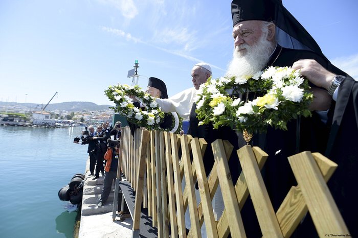 Pope Francis throws wreaths with Patriarch Bartholomew I and Archbishop Jerome in the port of Mytilene on the island of Lesbos, Greece, in memory of migrants who died at sea trying to reach Europe. Photograph: Osservatore Romano/Reuters