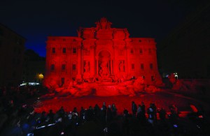 The Trevi Fountain in Rome is lit in red during an event to raise awareness of the plight of Christian martyrs April 29. (CNS photo/Paul Haring)