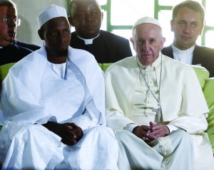 Pope Francis sits next to Imam Tidiani Moussa Naibi during a meeting with the Muslim community at the Koudoukou mosque in Bangui, Central African Republic, Nov. 30. (CNS photo/Stefano Rellandini, Reuters) See POPE-BANGUI-PEACE Nov. 30, 2015.