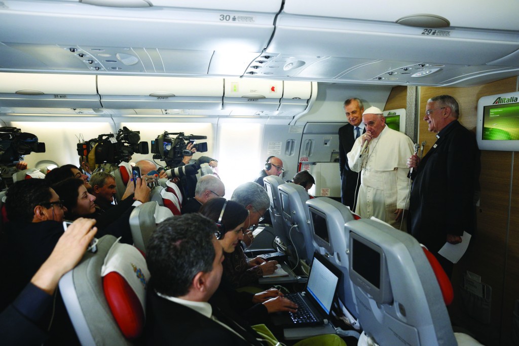 Pope Francis greets journalists aboard his flight to Havana Feb. 12. Traveling to Mexico for a six-day visit, the pope is stopping briefly in Cuba to meet with Russian Orthodox Patriarch Kirill of Moscow at the Havana airport. (CNS photo/Paul Haring) See POPE-PLANE-START Feb. 12, 2016.