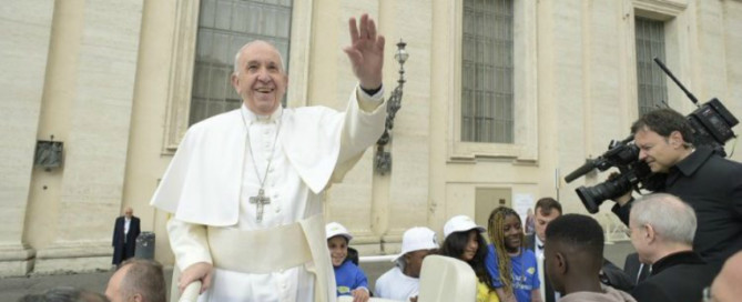 Pope Francis waves to the crowds at the General Audience (Vatican Media)